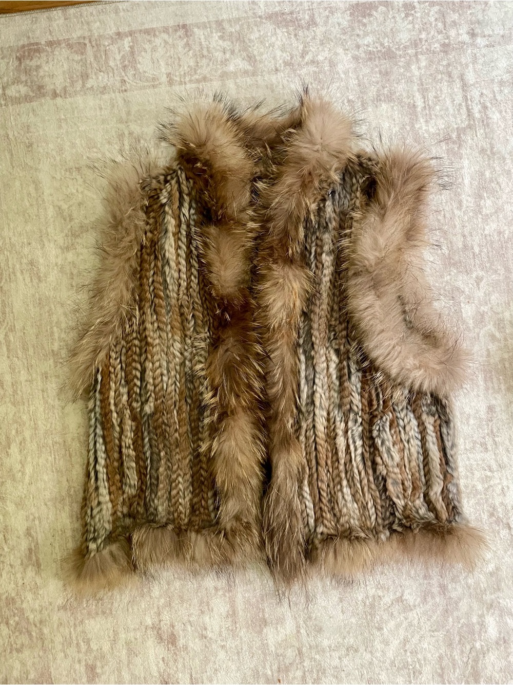 Genuine rabbit fur vest with racoon trim
Extremely soft and lightweight